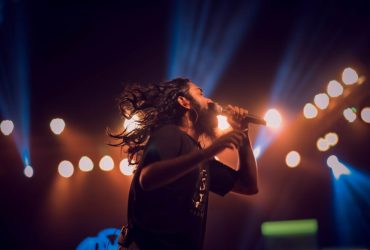 man holding microphone on stage